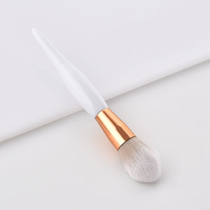 White and bronze make up brushes