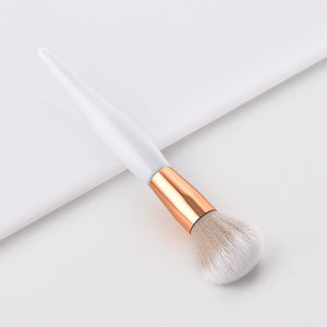 White and bronze make up brushes